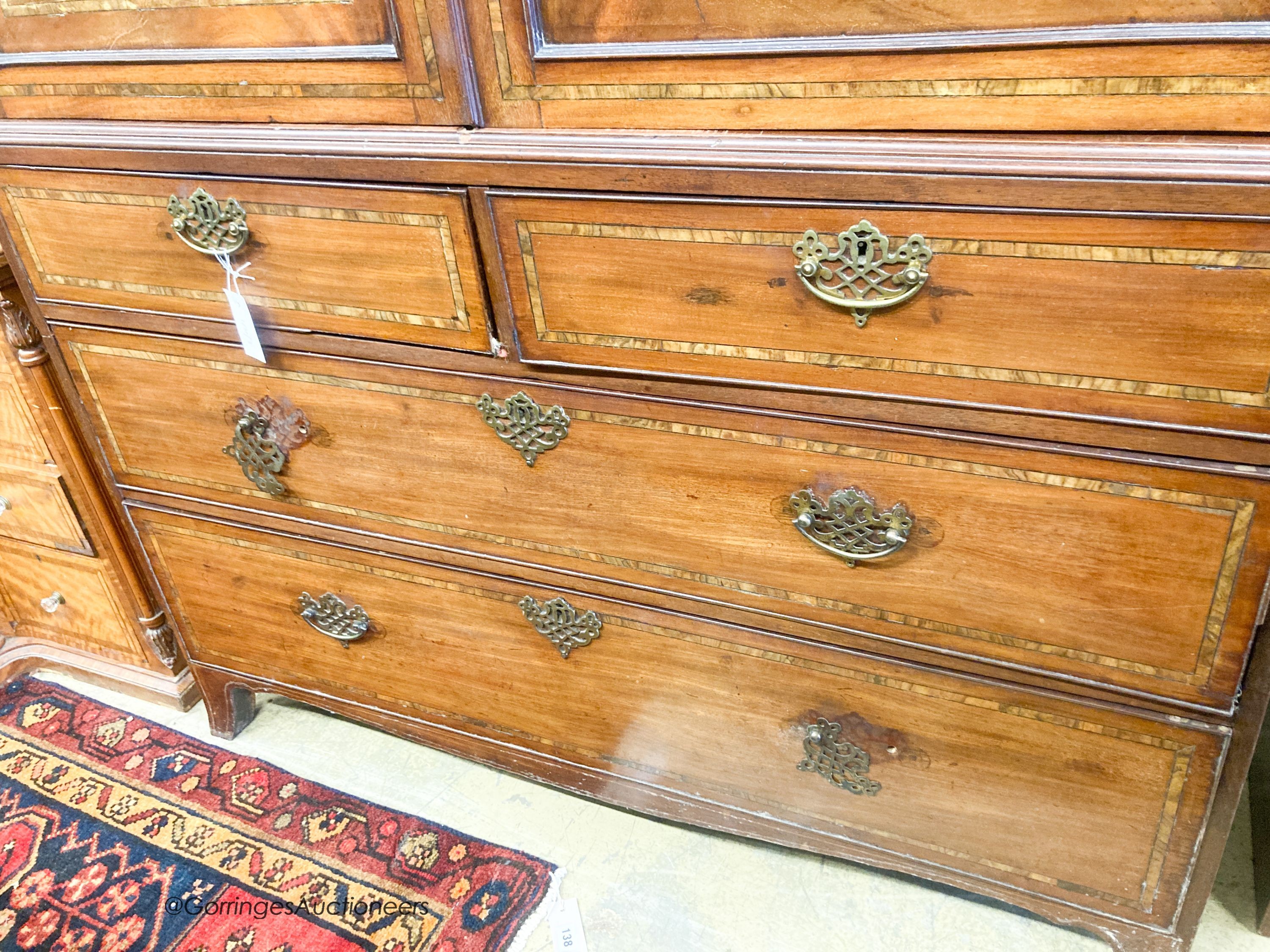 A George III inlaid mahogany linen press (lacks slides), width 126cm, depth 58cm, height 212cm